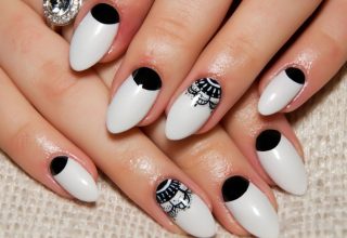 Almond shaped nails with classic design.
