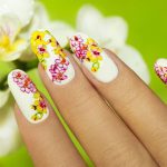 Pink and yellow flower nail art for summer.