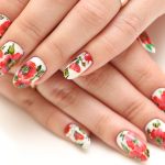 Nail art featuring poppies.