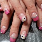 Pink nails with Hello Kitty motif.