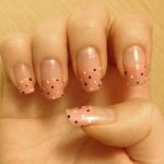 Black and white polka dots on pink base.