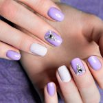Pastel nail art with shades of lilac.